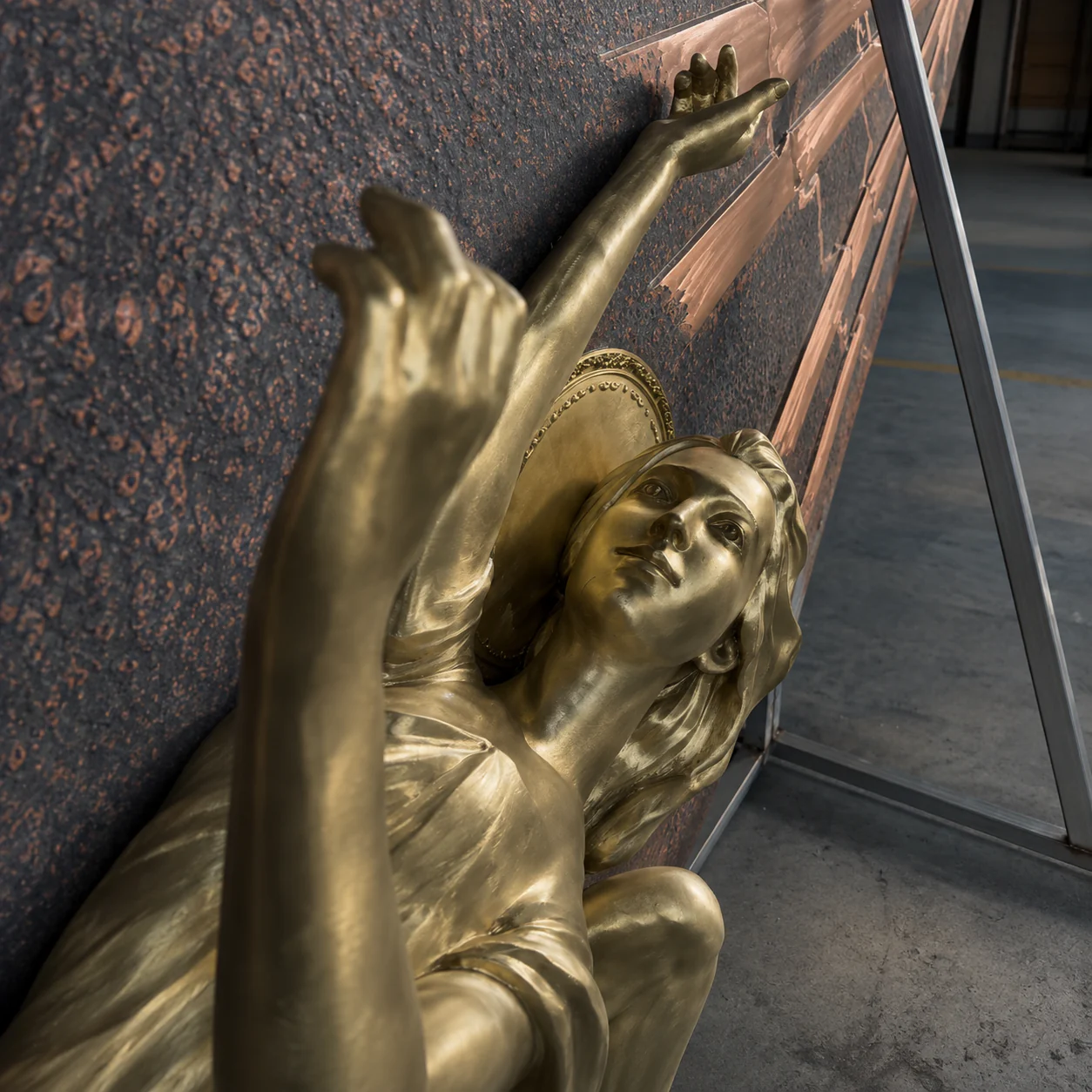 A gilded figurative sculpture in the SHYDOOR workshop
